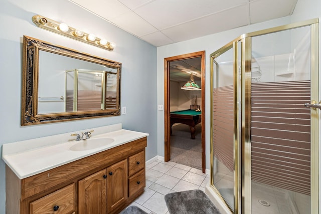 bathroom with tile patterned floors, vanity, and a shower with shower door