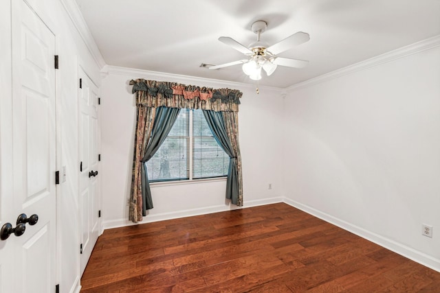 unfurnished room with ceiling fan, dark hardwood / wood-style flooring, and ornamental molding