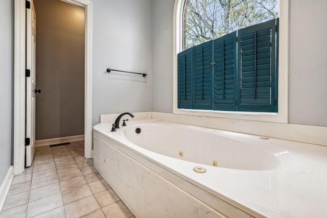 bathroom featuring tile patterned floors and a bathing tub