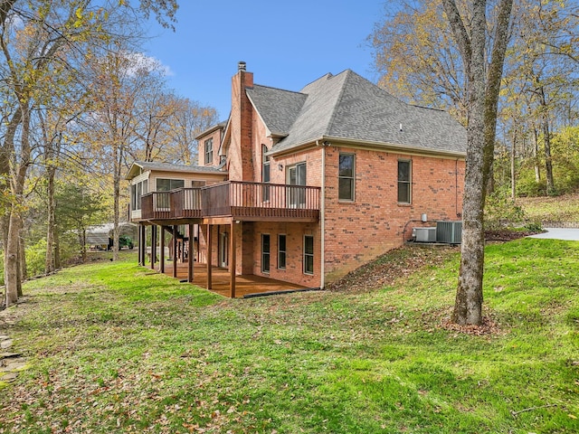 back of property featuring a patio, cooling unit, a lawn, and a wooden deck