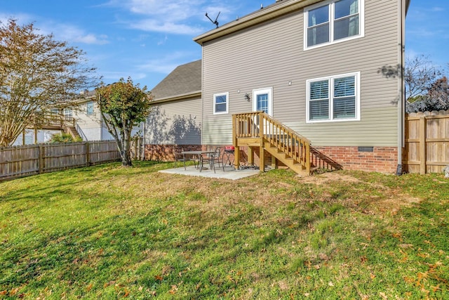 back of house with a yard and a patio