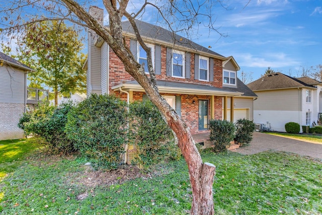 view of front facade featuring a garage and a front yard