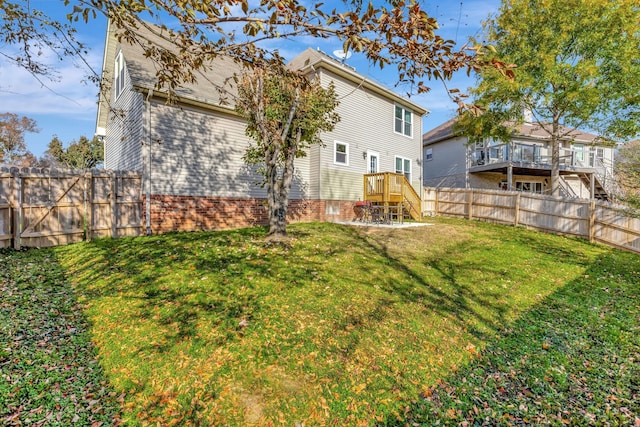 rear view of property with a lawn