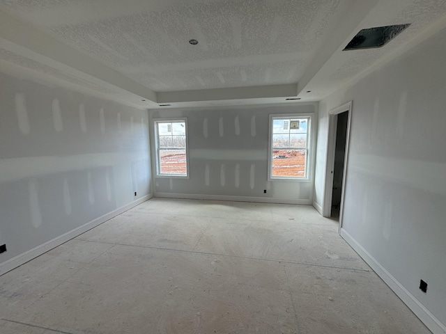 unfurnished room featuring plenty of natural light