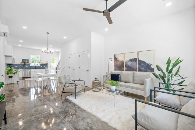 living room with ceiling fan with notable chandelier