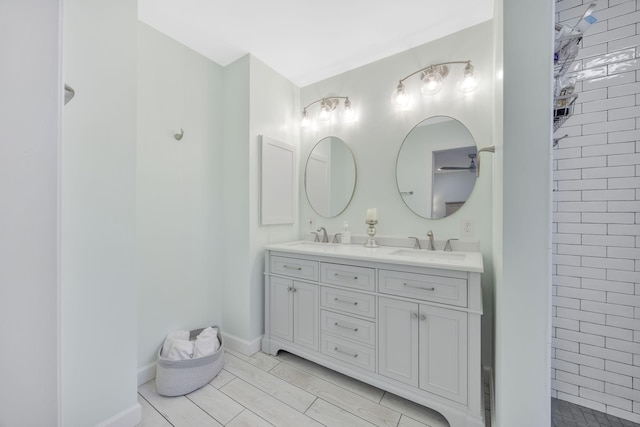 bathroom featuring vanity and tiled shower