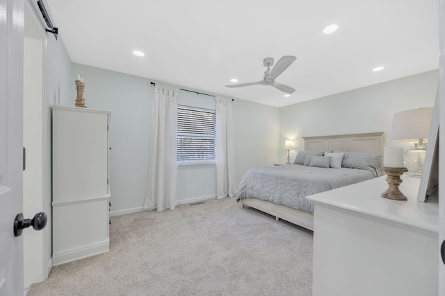 bedroom featuring ceiling fan and light carpet