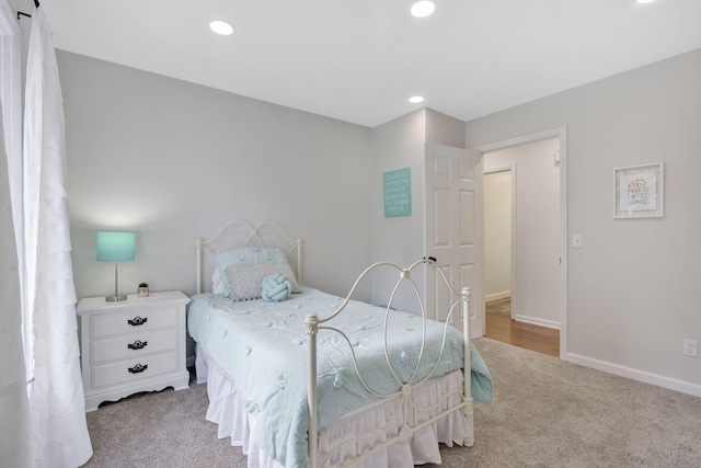 bedroom featuring light colored carpet