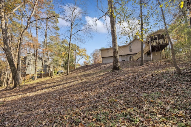 view of yard with a sunroom