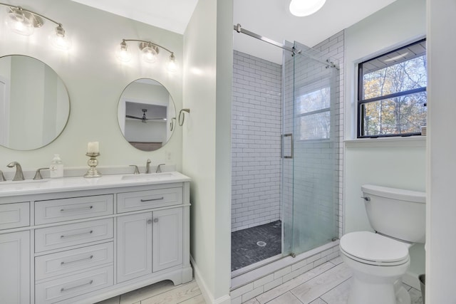 bathroom featuring hardwood / wood-style floors, toilet, an enclosed shower, and vanity