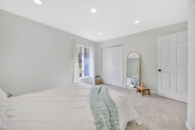 carpeted bedroom featuring a closet