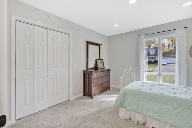 carpeted bedroom featuring a closet