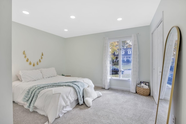 carpeted bedroom featuring a closet