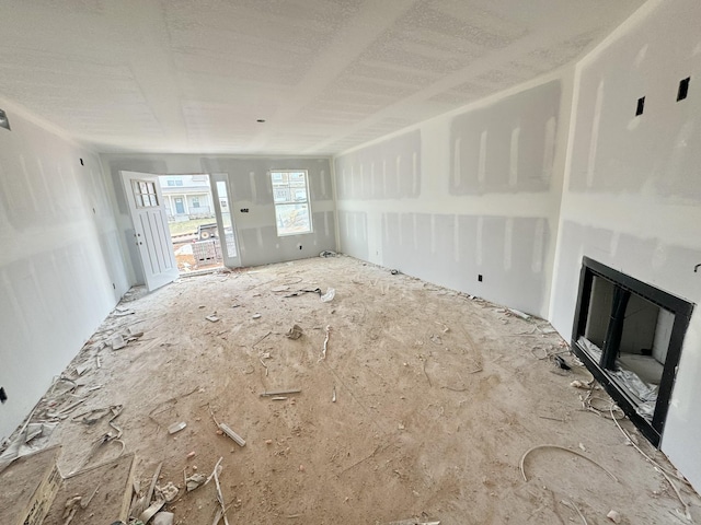 unfurnished living room with a fireplace