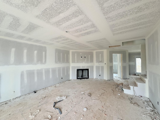 unfurnished living room featuring a fireplace