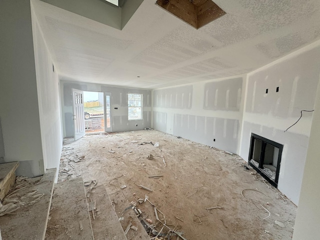 unfurnished living room featuring a fireplace