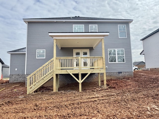 back of property featuring stairs, a wooden deck, and crawl space