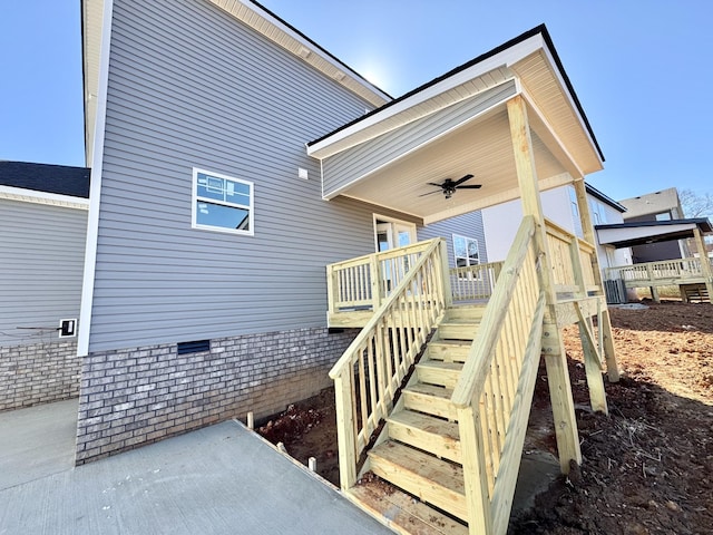 doorway to property featuring crawl space and a ceiling fan