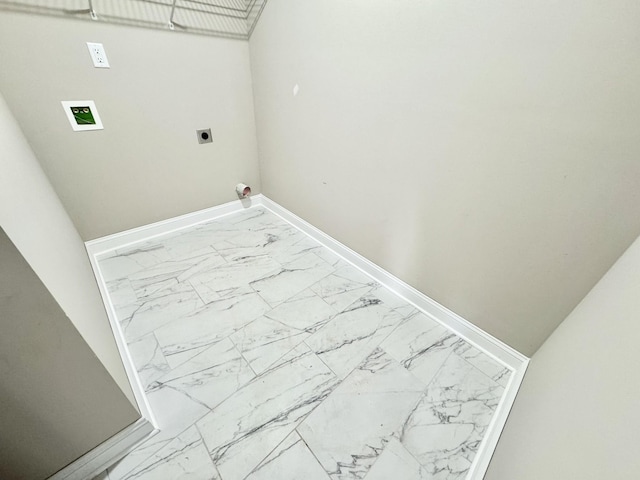 laundry area with laundry area, marble finish floor, electric dryer hookup, and baseboards