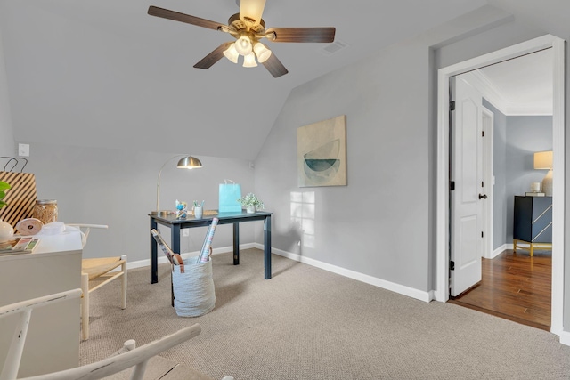 home office featuring carpet floors, ceiling fan, and lofted ceiling