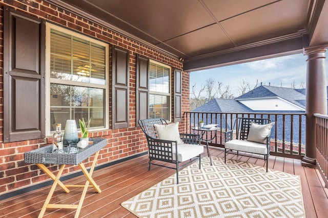 wooden terrace featuring covered porch