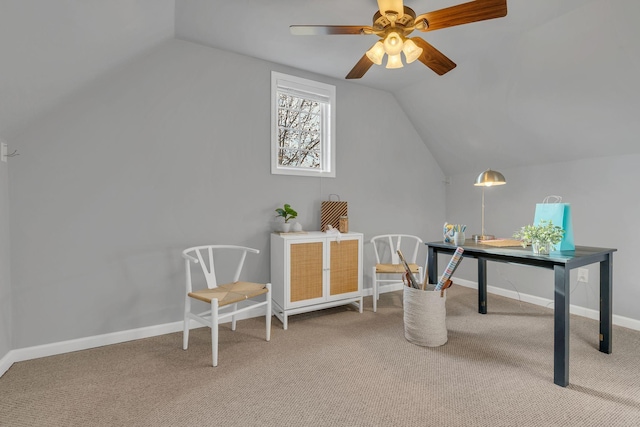 home office featuring carpet floors, vaulted ceiling, and ceiling fan