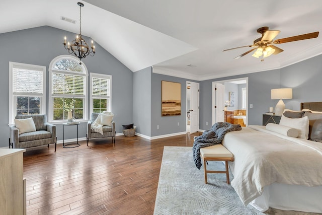 bedroom with lofted ceiling, dark wood-type flooring, ceiling fan with notable chandelier, and ornamental molding