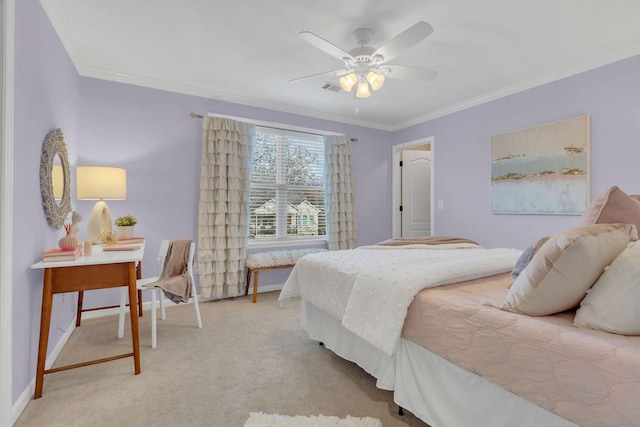 carpeted bedroom with ceiling fan and crown molding