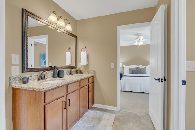 bathroom featuring tile patterned flooring, vanity, and ceiling fan