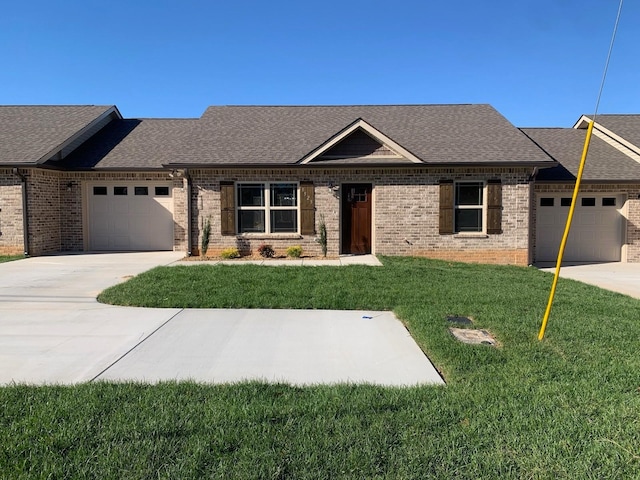 view of front of home with a garage and a front yard