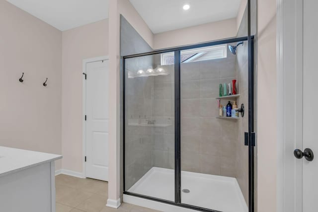 bathroom with tile patterned floors and an enclosed shower