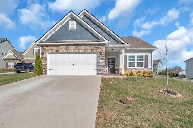 craftsman-style home with a garage and a front lawn