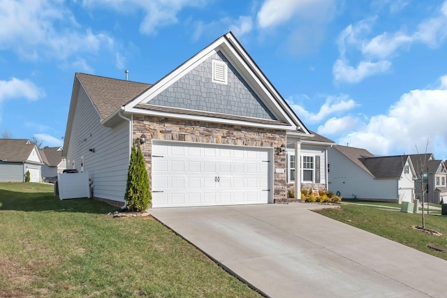 view of front of house with a garage and a front yard