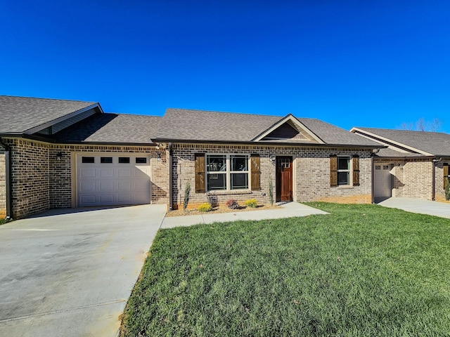 view of front of house with a garage and a front lawn