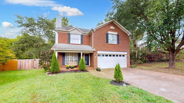 front of property featuring a garage and a front lawn