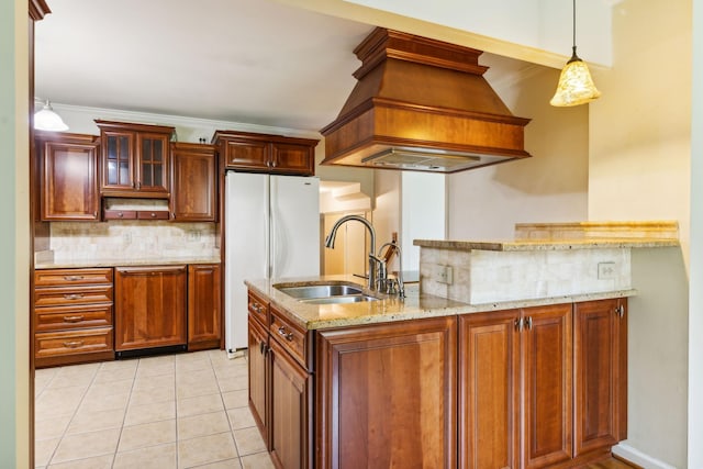 kitchen with white refrigerator, ornamental molding, sink, and light tile patterned floors