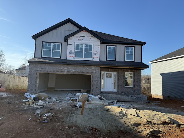 property in mid-construction with a garage