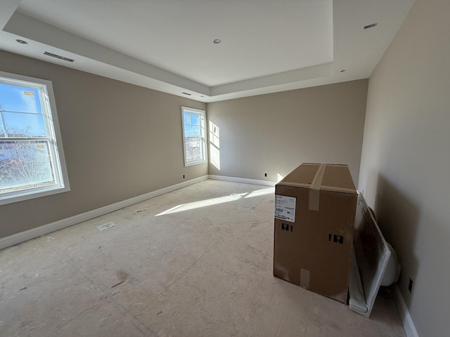 empty room with a tray ceiling