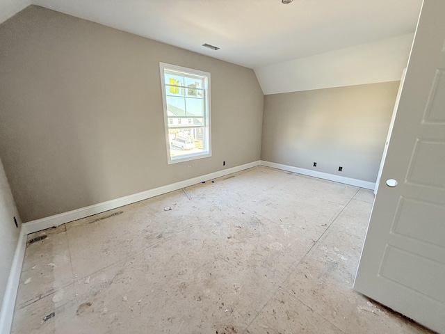 bonus room featuring vaulted ceiling