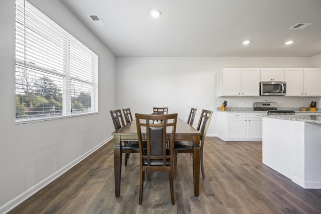 dining room featuring dark hardwood / wood-style floors