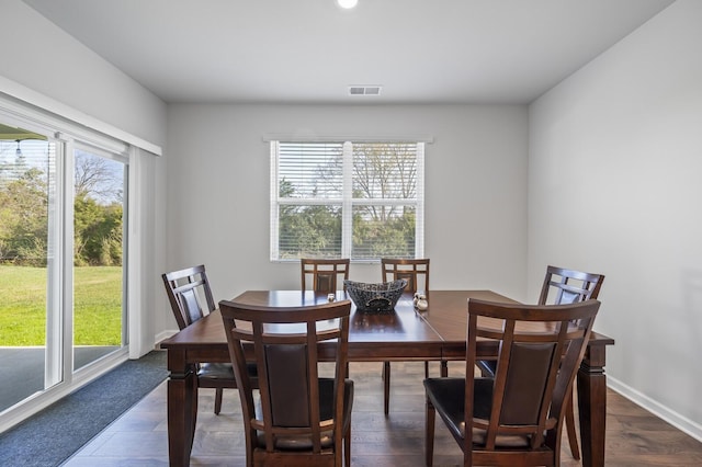 dining space featuring dark hardwood / wood-style flooring