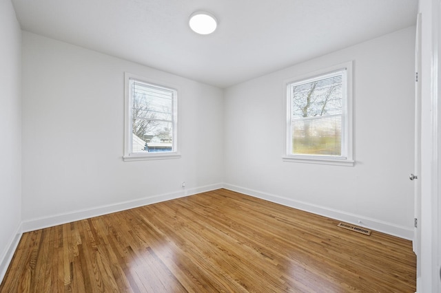 unfurnished room featuring wood-type flooring