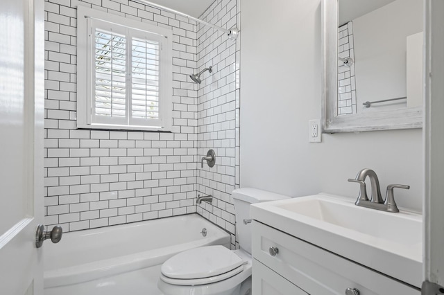 full bathroom with vanity, toilet, and tiled shower / bath