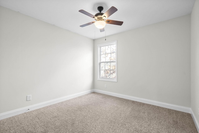 spare room featuring carpet flooring and ceiling fan