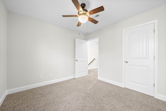 unfurnished bedroom featuring carpet and ceiling fan