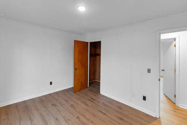 unfurnished bedroom featuring light wood-type flooring