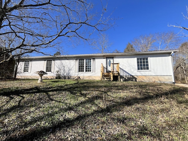 back of house with a yard