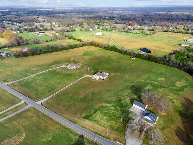 birds eye view of property featuring a rural view