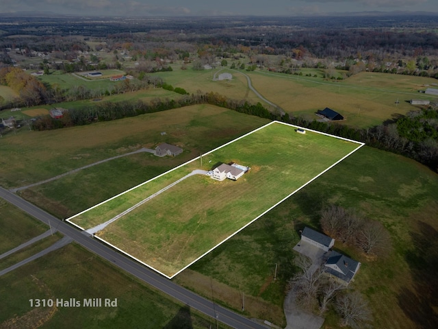 birds eye view of property featuring a rural view