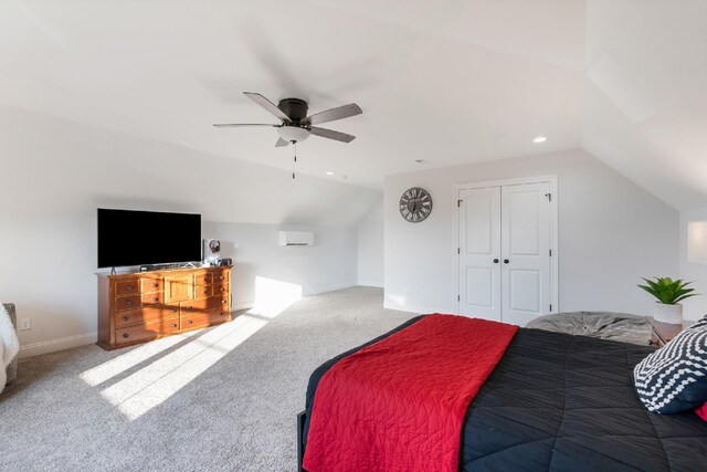 carpeted bedroom featuring ceiling fan, a closet, and lofted ceiling